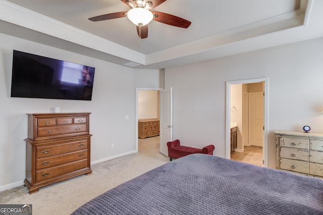 carpeted bedroom with connected bathroom, crown molding, a raised ceiling, and ceiling fan