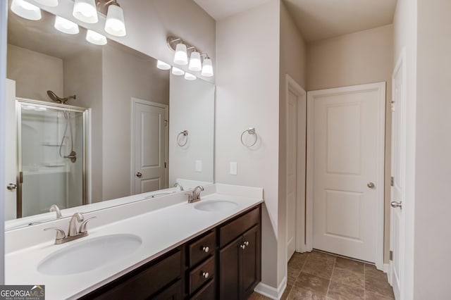 bathroom with an enclosed shower and vanity