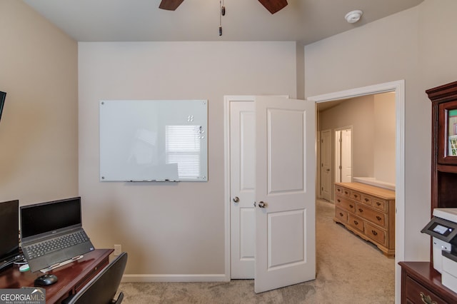 office space featuring light colored carpet and ceiling fan