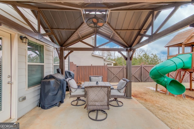 view of patio / terrace with area for grilling and a playground