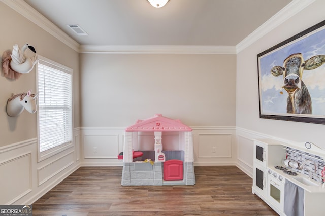 recreation room with crown molding and hardwood / wood-style flooring