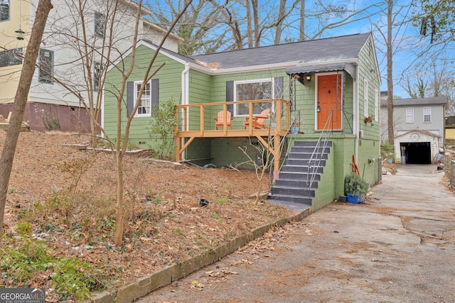 bungalow-style house featuring a garage