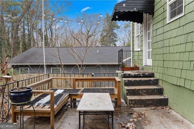 wooden terrace featuring a patio