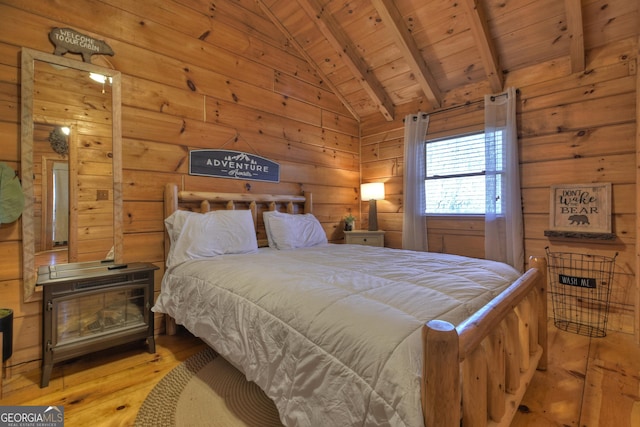 bedroom with vaulted ceiling with beams, wood ceiling, and light wood-type flooring