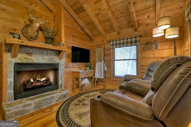 living room with hardwood / wood-style flooring, wood walls, lofted ceiling with beams, and wooden ceiling