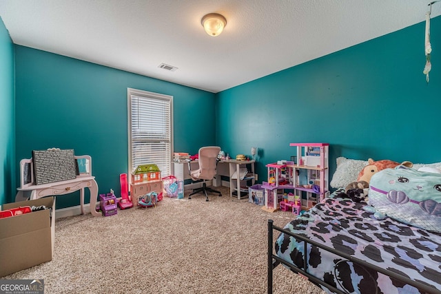 carpeted bedroom with a textured ceiling