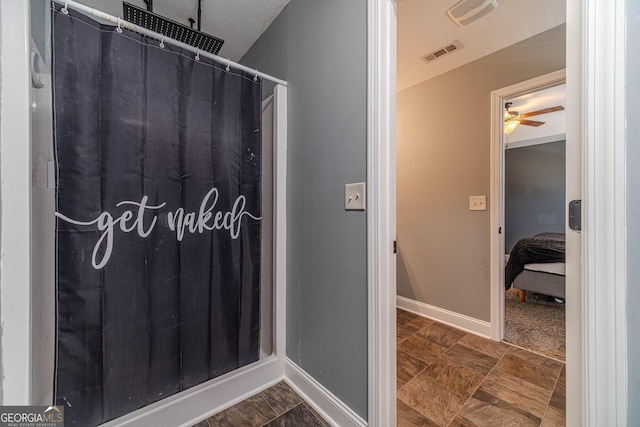 bathroom featuring ceiling fan