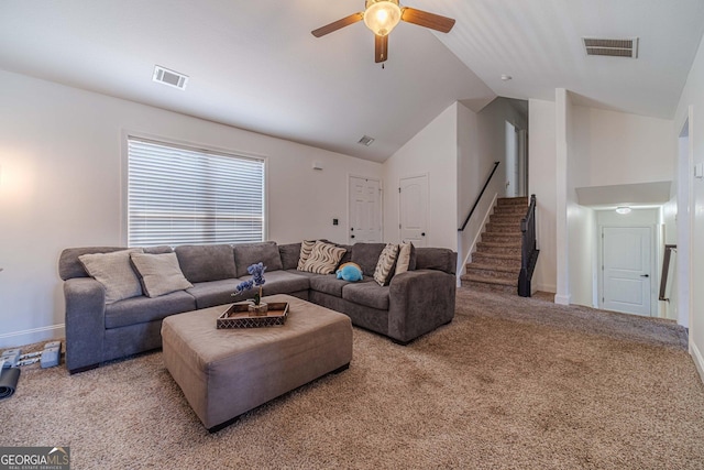 carpeted living room featuring vaulted ceiling and ceiling fan