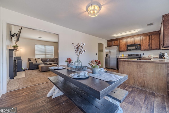 dining room featuring dark hardwood / wood-style floors