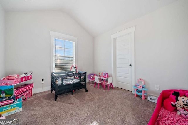 rec room featuring carpet flooring and vaulted ceiling