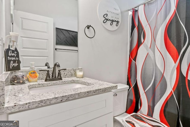 bathroom with vanity and toilet