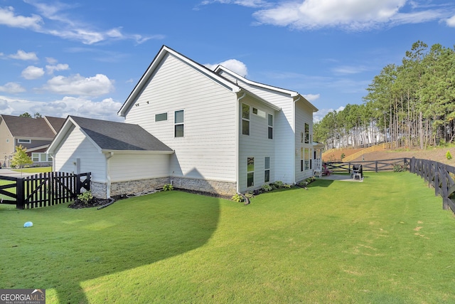 back of house featuring a yard