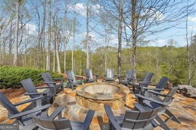 view of patio / terrace with a fire pit