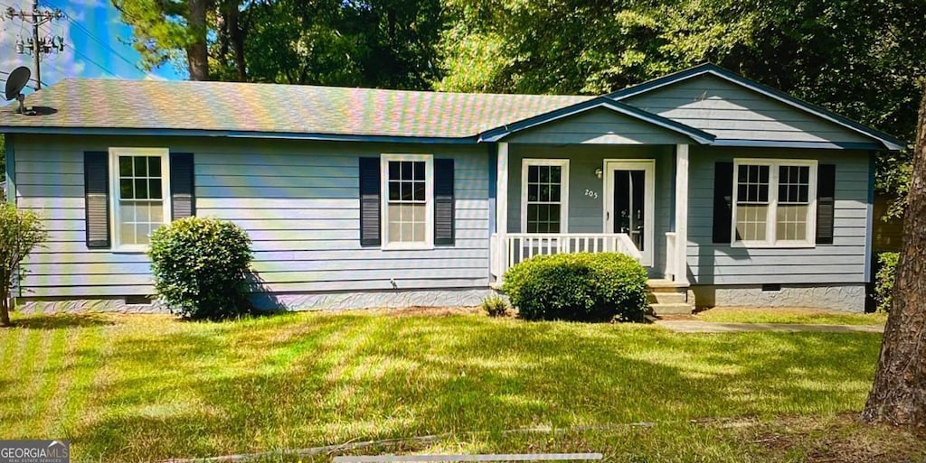 view of front of home with a front yard