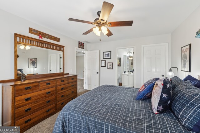 carpeted bedroom with ceiling fan and connected bathroom