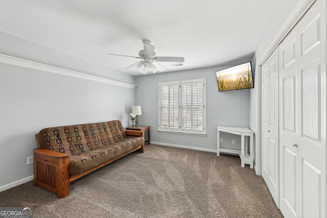 sitting room with carpet floors and ceiling fan