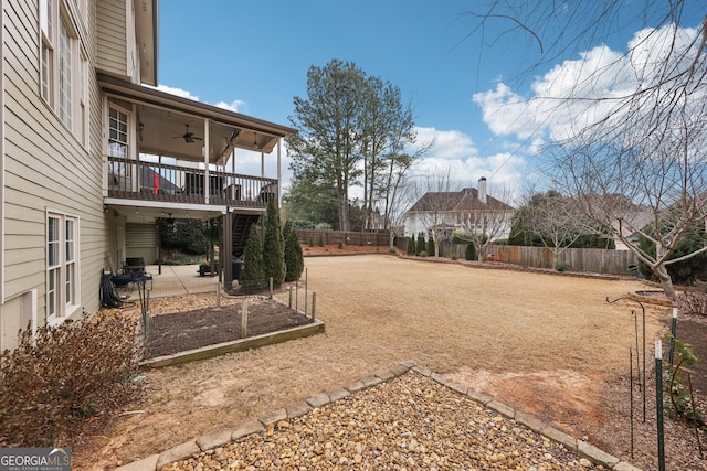 view of yard featuring ceiling fan and a patio area