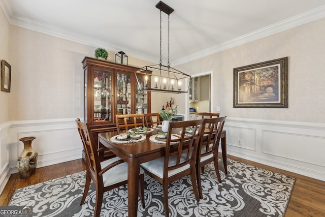 dining area featuring crown molding and dark hardwood / wood-style floors