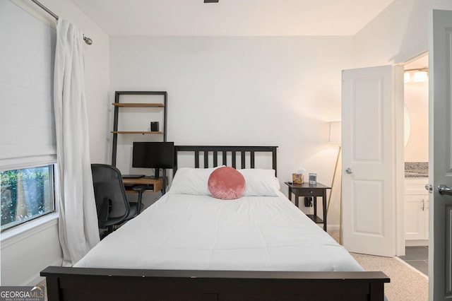 bedroom featuring light colored carpet