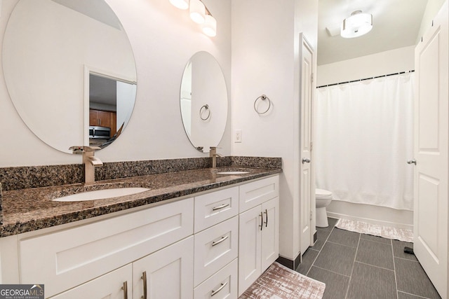 full bathroom with vanity, toilet, tile patterned flooring, and shower / bath combo