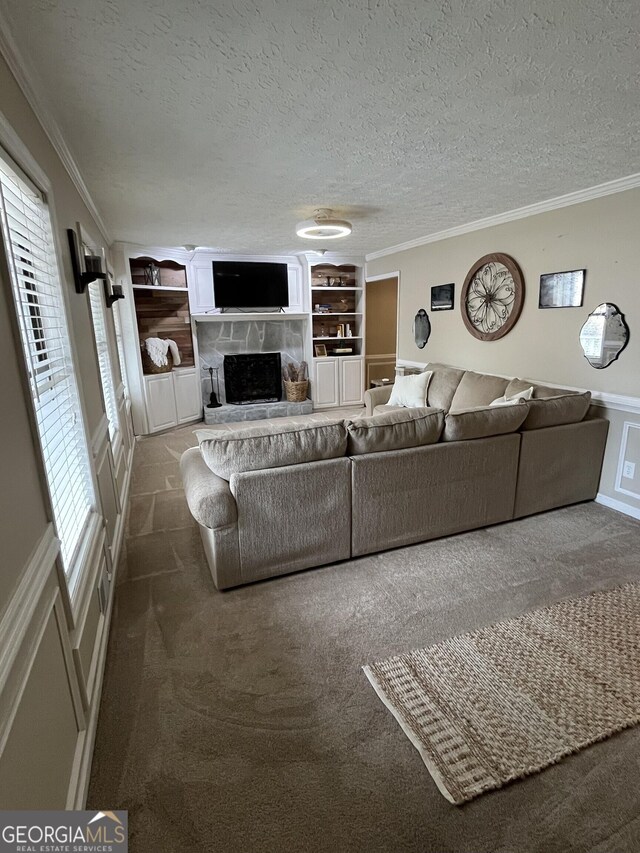 bedroom with ceiling fan, dark carpet, and a textured ceiling