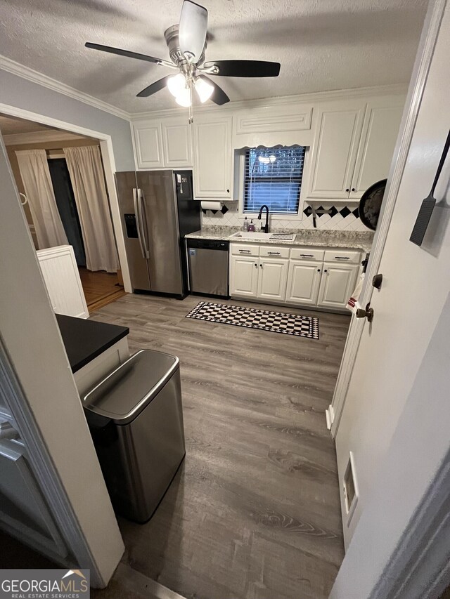 bathroom featuring vanity, toilet, and a textured ceiling