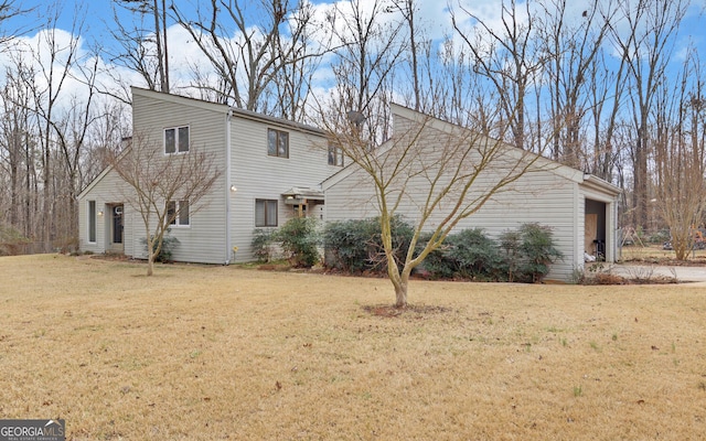 view of home's exterior featuring a yard and a garage