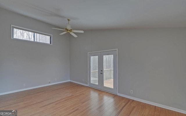 spare room featuring french doors, ceiling fan, high vaulted ceiling, and light wood-type flooring