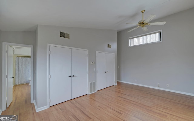 unfurnished bedroom featuring ceiling fan, high vaulted ceiling, light hardwood / wood-style floors, and a closet