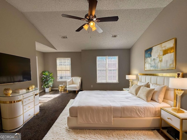 bedroom featuring ceiling fan, lofted ceiling, light carpet, and a textured ceiling