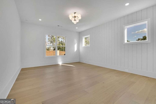 spare room with light hardwood / wood-style flooring