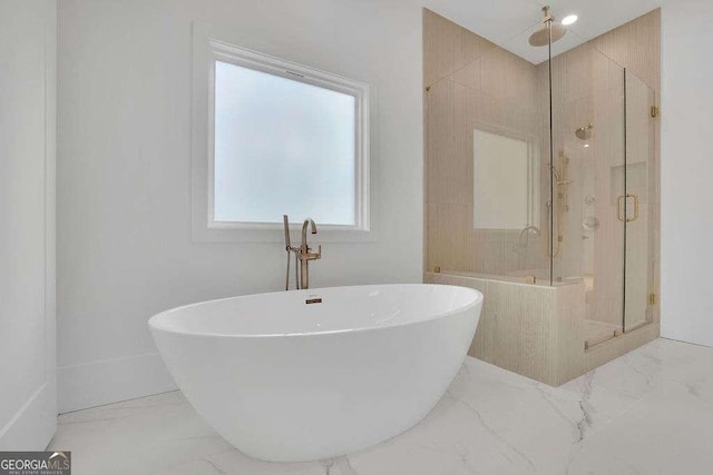 bathroom with shower with separate bathtub