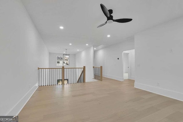 interior space featuring ceiling fan and light wood-type flooring