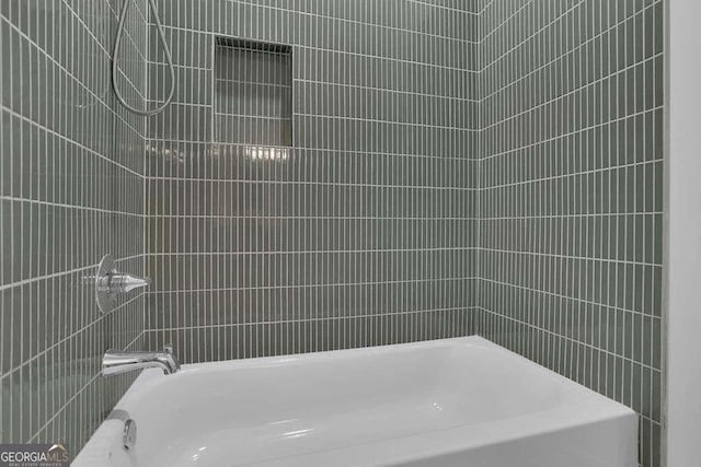 bathroom with shower / bathing tub combination