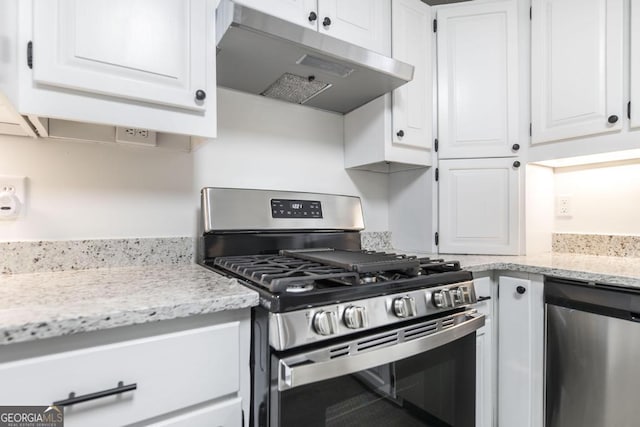 kitchen with white cabinetry, light stone countertops, and appliances with stainless steel finishes