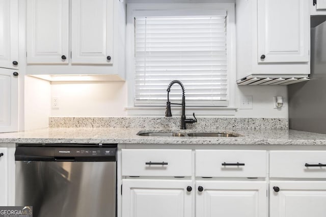 kitchen with white cabinetry, light stone countertops, sink, and stainless steel dishwasher