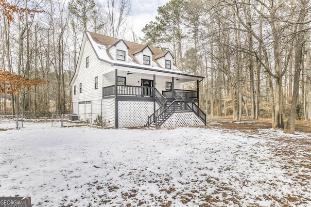 view of front of home featuring a porch and a garage