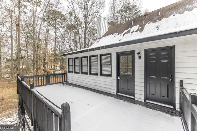 doorway to property with a wooden deck