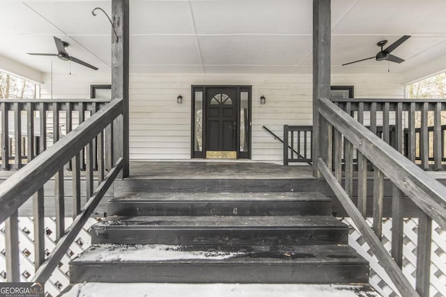 view of exterior entry featuring ceiling fan