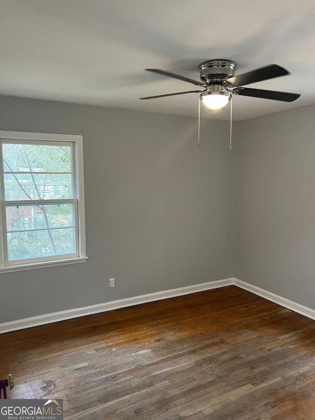 empty room with dark wood-type flooring