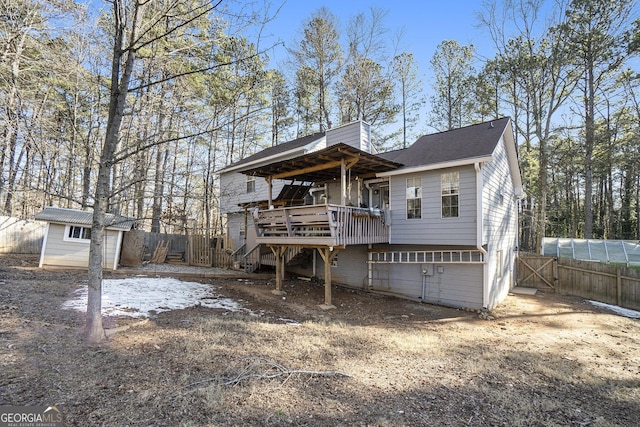 view of front facade featuring a deck and a shed