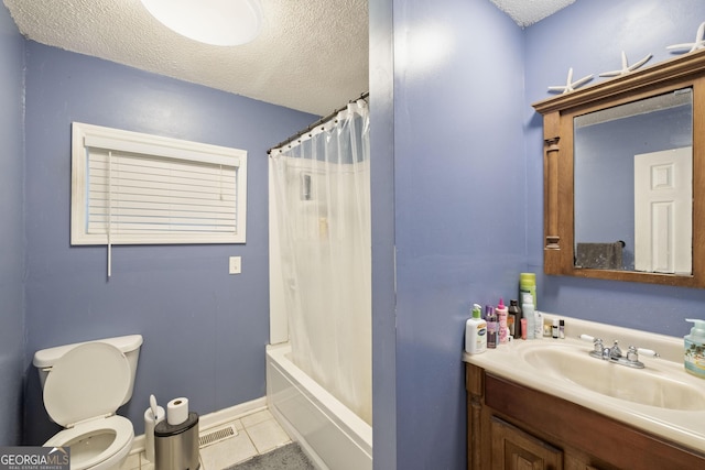 full bathroom with shower / bath combo, tile patterned floors, toilet, and a textured ceiling