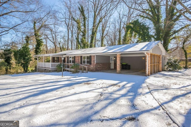 ranch-style house with a garage and a porch