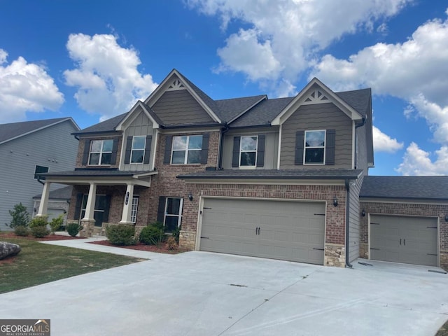 craftsman-style home featuring a porch and a garage