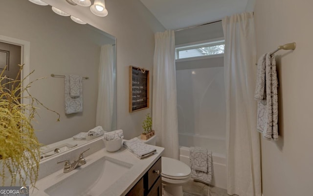 full bathroom featuring vanity, shower / bath combo, and toilet