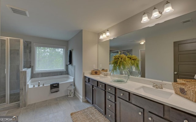 bathroom with vanity, independent shower and bath, and tile patterned flooring