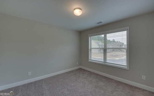 spare room featuring carpet flooring