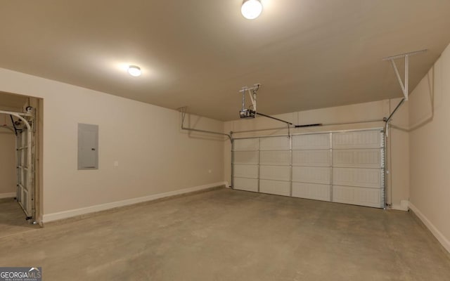 garage with a garage door opener and electric panel