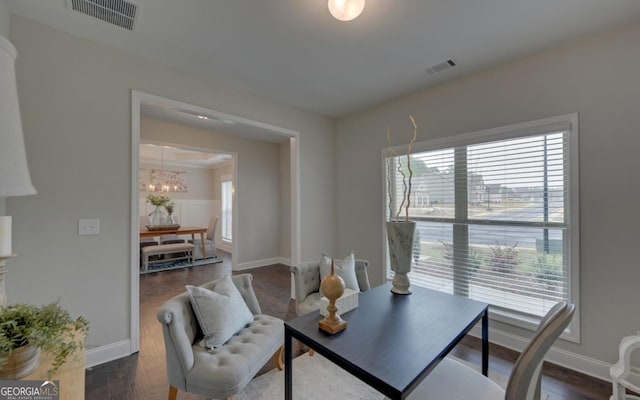 office area with a healthy amount of sunlight and dark hardwood / wood-style flooring