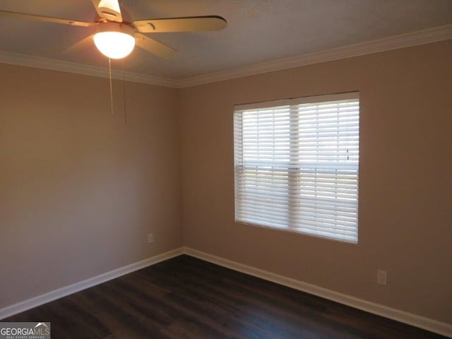 spare room with ceiling fan, ornamental molding, and dark hardwood / wood-style flooring